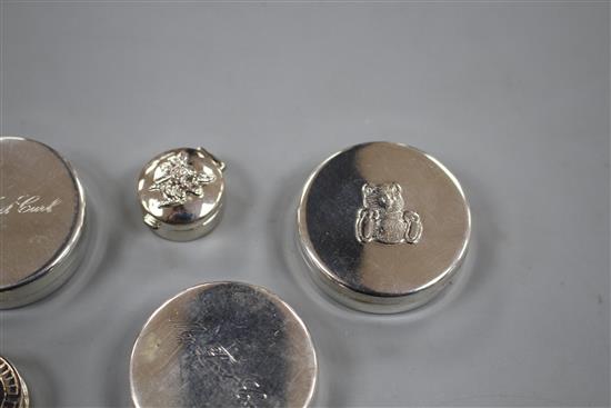 Six modern silver tooth fairy circular boxes, including two My First Curl boxes and one surmounted with a steam engine,